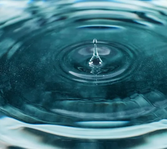 pexels-cottonbro-9667516 Drop of water creating subtle ripples spreading outward.